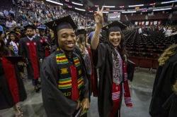 Students in caps and gowns at graduation